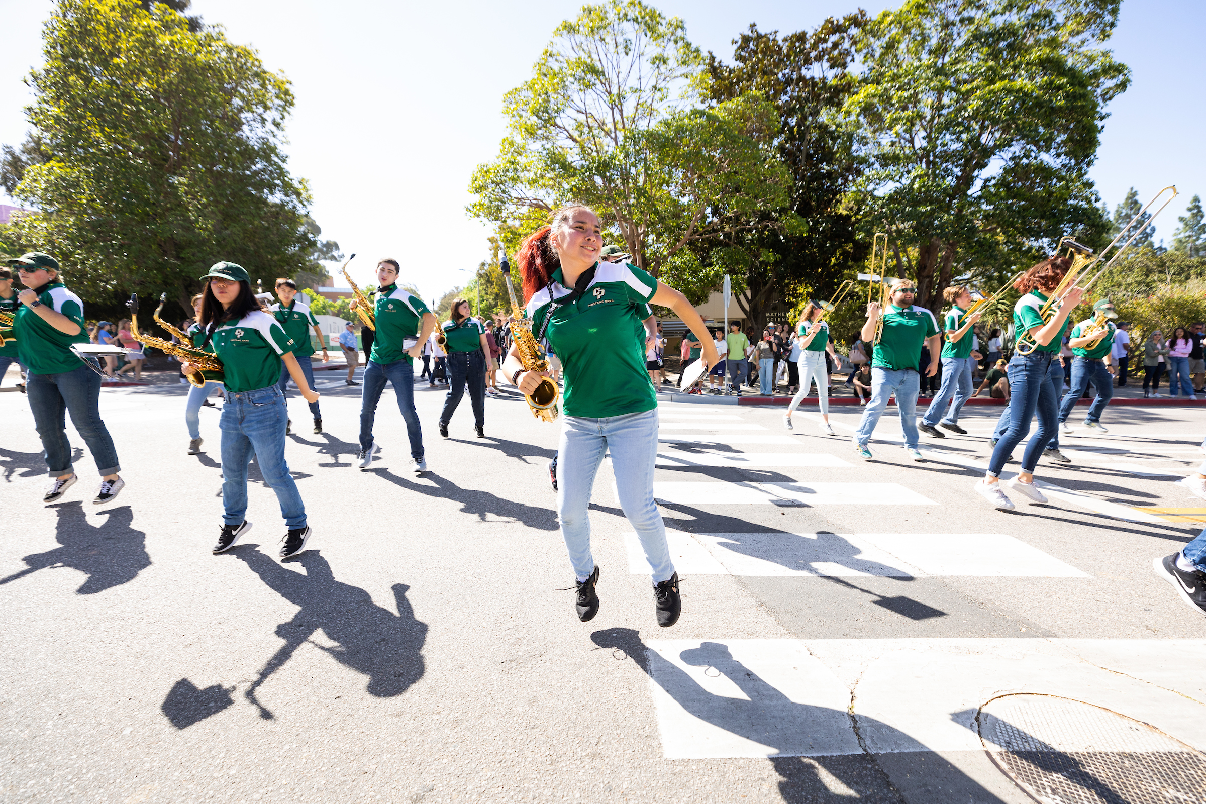Cal Poly band members dance during a performance at Open House.
