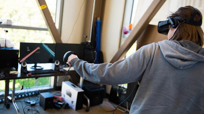 Student experimenting with Virtual Reality game