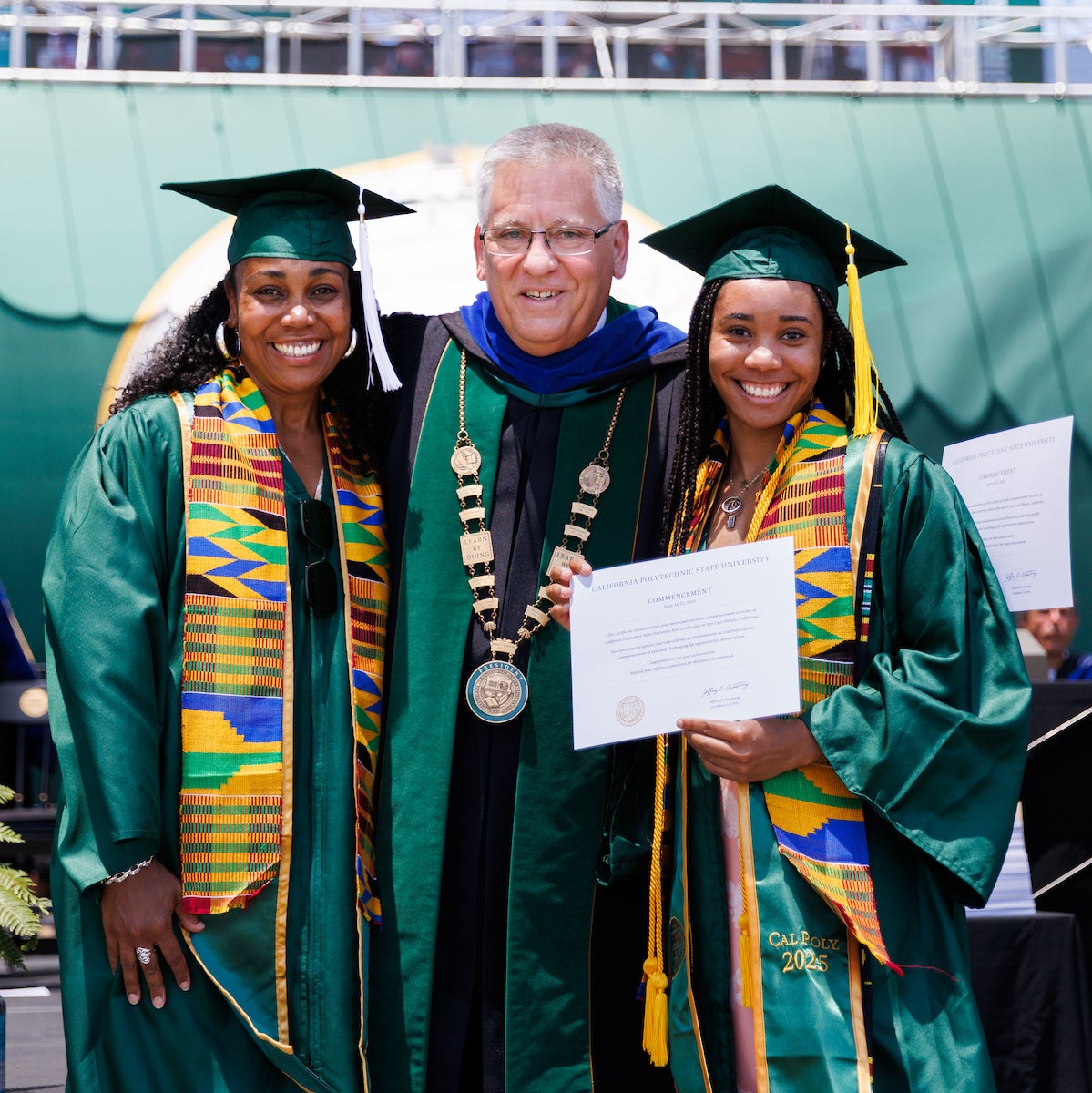 From left: Dionna Glover, Jeffrey Armstrong and Genesis Glover smile for a photo at commencement.