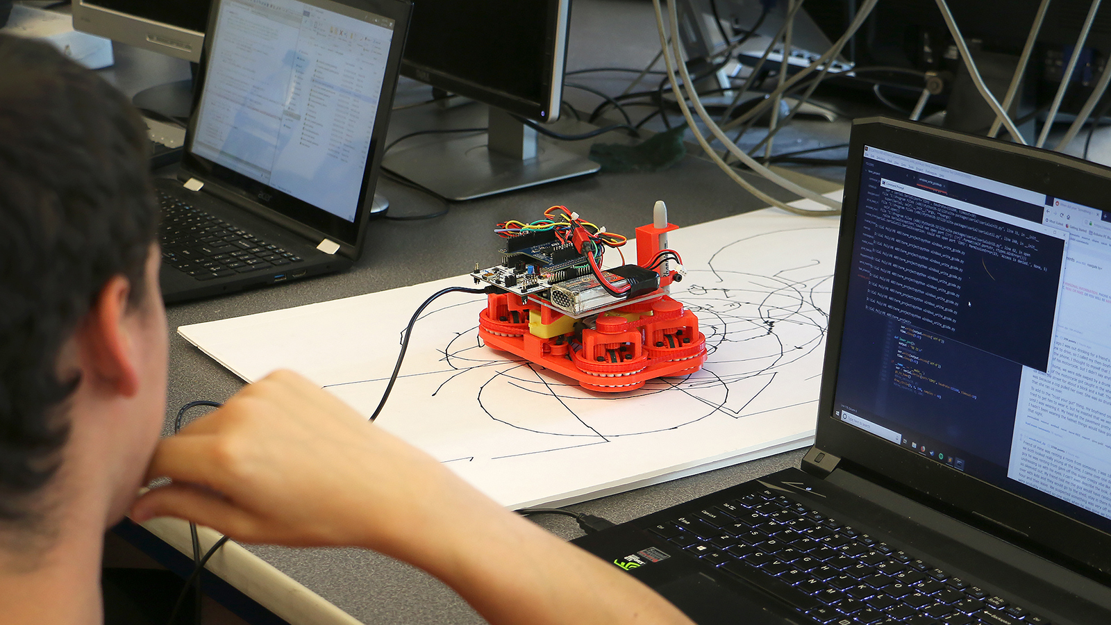 Mechanical Engineering students work with autonomous robots in the Mechatronics Lab.