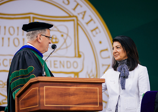 President Armstrong presents an honorary degree to the wife of Katcho Achadjian