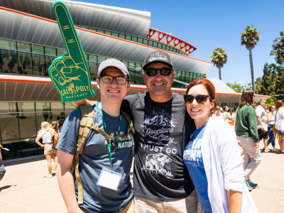 Cal Poly parents and their son stand outside the PAC