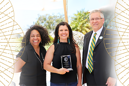 President Armstrong and Chief Diversity Officer Denise Isom stand with Dr. Jenell Navarro who is holding her 2022 Dolores Huerta “Si Se Puede” Award for Transformational Leadership