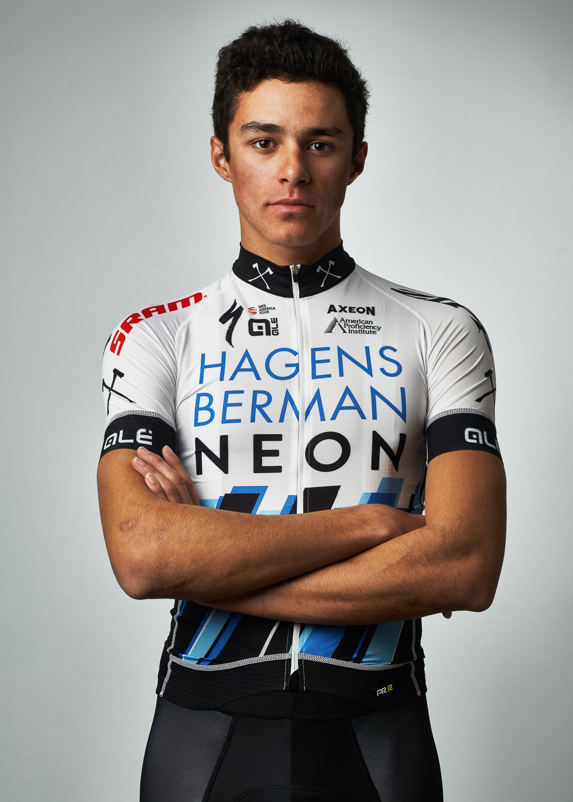 A portrait of Christopher Blevins in a racing uniform.