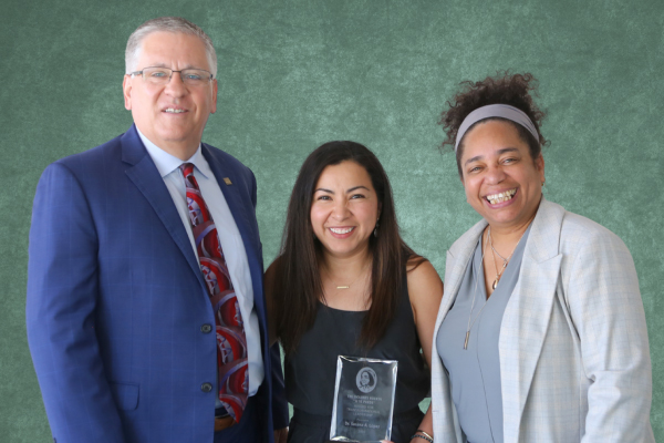 President Armstrong, Denise Isom pose with award recipient Susana López