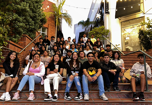A group of Upward Bound students gather on the stairs of a downtown shopping center in San Luis Obispo