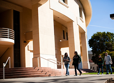 Students walk past the Orfalea College of Business
