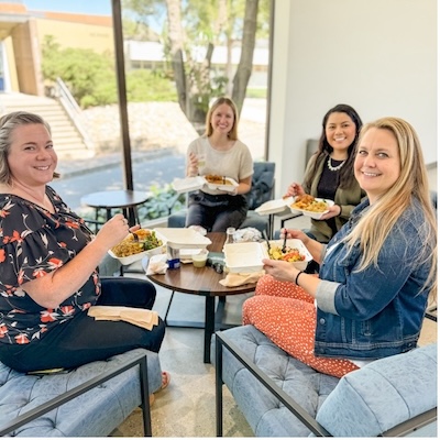 Group of co-workers enjoying lunch in Cal Poly Partners Pavilion.