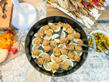 Buffet of food dishes displayed together.