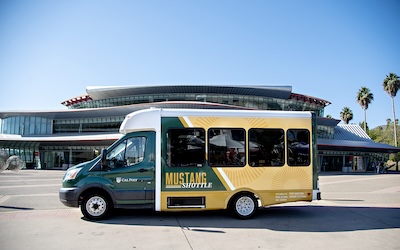 Mustang shuttle bus in front of the Performing Arts Center.