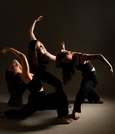 Three dancers performing