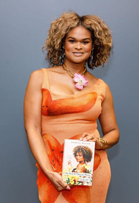 Portrait of Rachel Willis holding her book