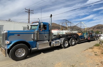 Cal Poly’s Rose Float’s half of the annual Rose Parade float is loaded on a tractor trailer, preparing to be moved to Pomona for final assembly and decoration.