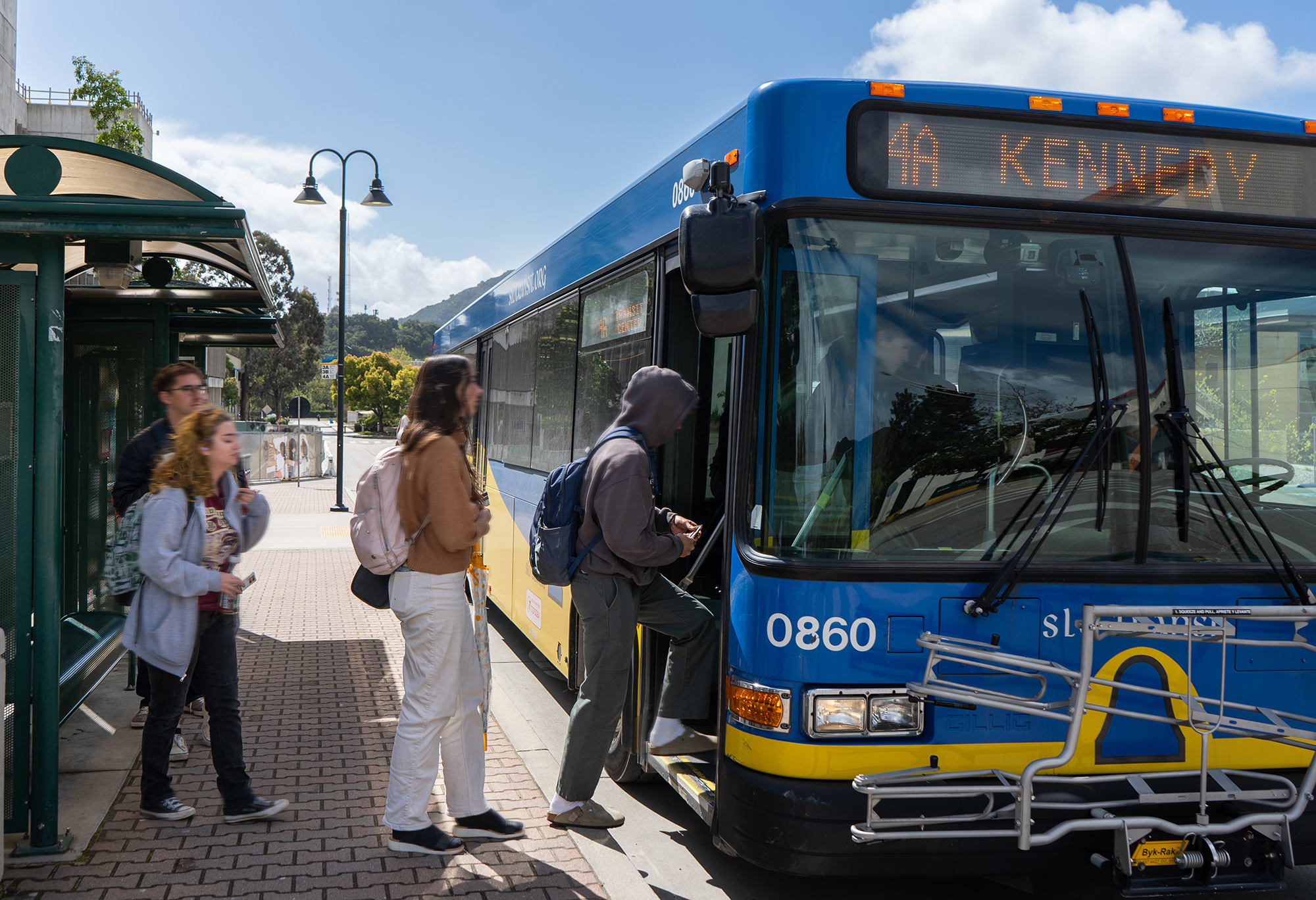 People board a SLO Transit bus.