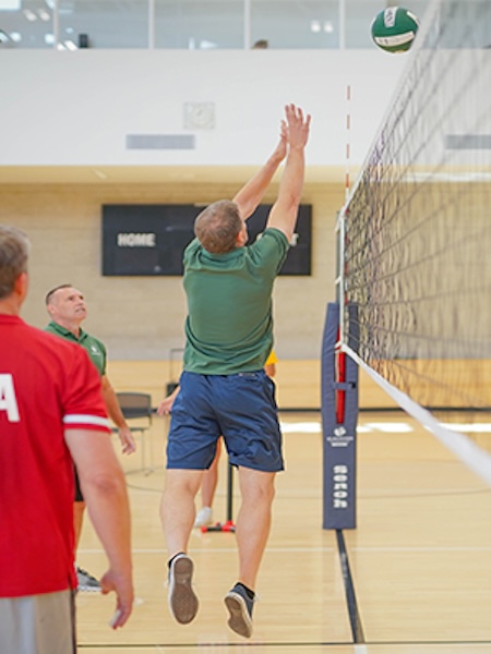 People playing indoor volleyball.