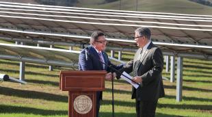 Congressman Salud Carbajal and President Jeffrey D. Armstrong shake hands at the dedication of the solar farm.