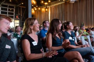 Attendees at the CIE's Demo Day event held at SLO Brew Rock applaud startup presentations.