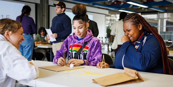 Students enjoy working together at a table. 