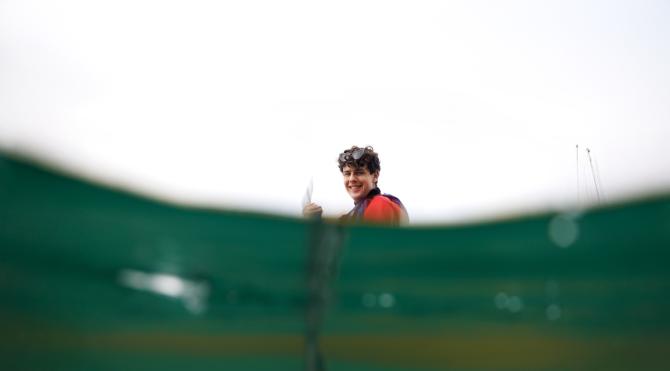 Student Luke Hansen smiles as he paddles a kayak in Morro Bay.