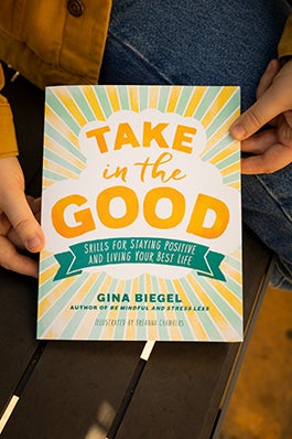 A close-up of the cover of the book, "Take in the Good."