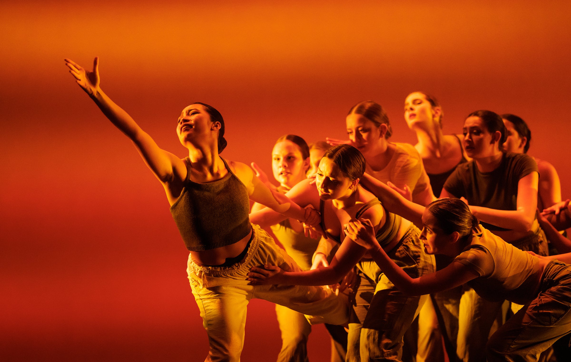 Student dancers wear two piece outfits to rehearse a number for the Orchesis Dance Company.