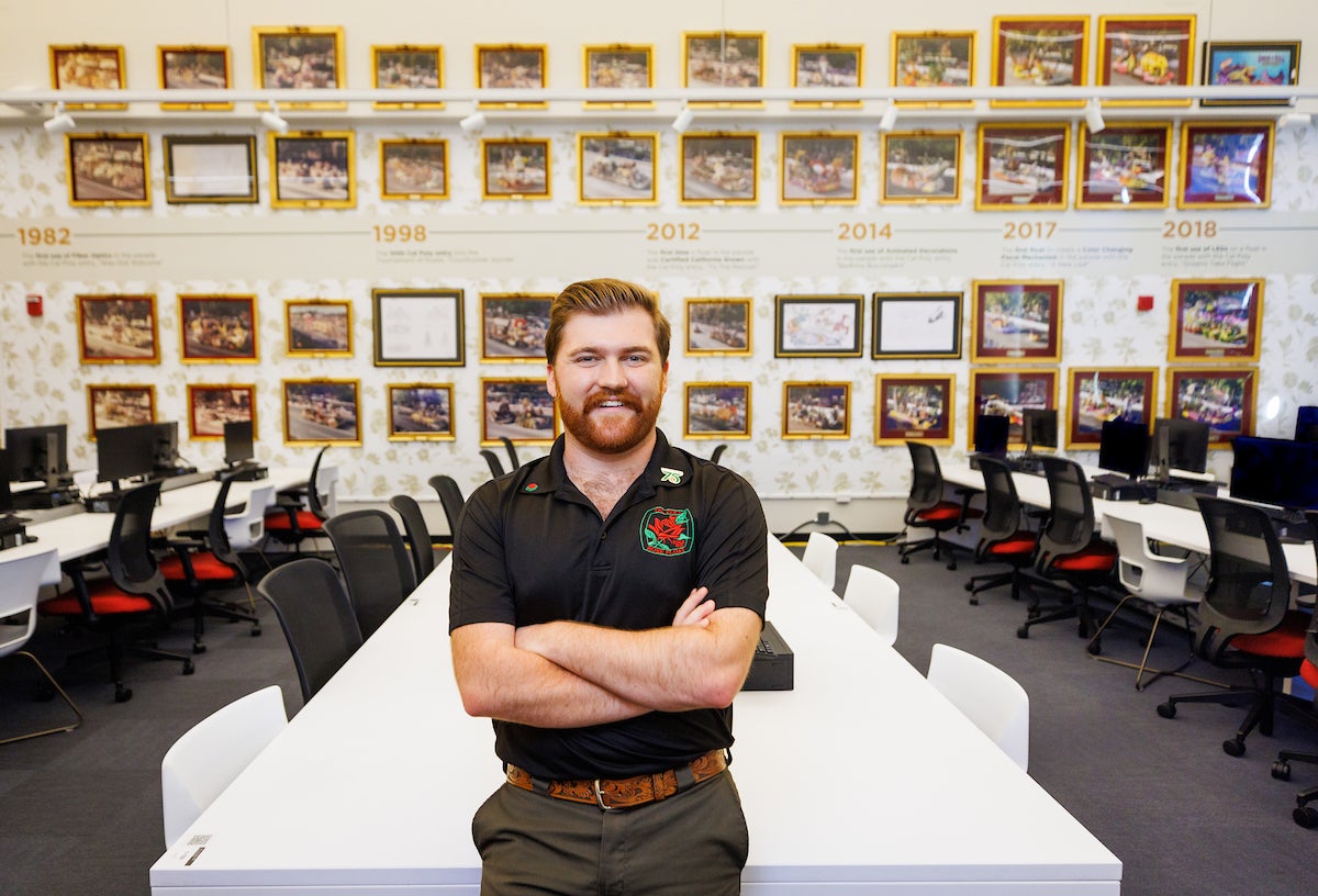 Collin Marfia stands in front of the study lounge he redid for his senior project.