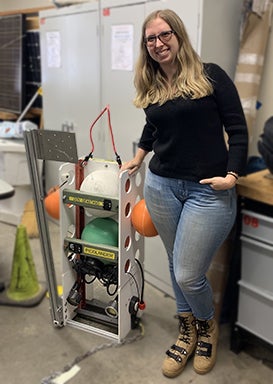 Nikki Arm with her thesis project, a deep ocean vehicle lander. 