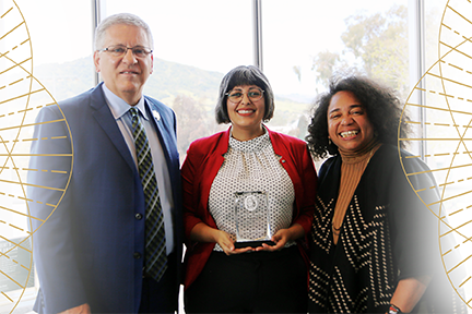 President Armstrong, awardee Adrienne Garcia-Specht and Denise Isom pose at the diversity awards event..