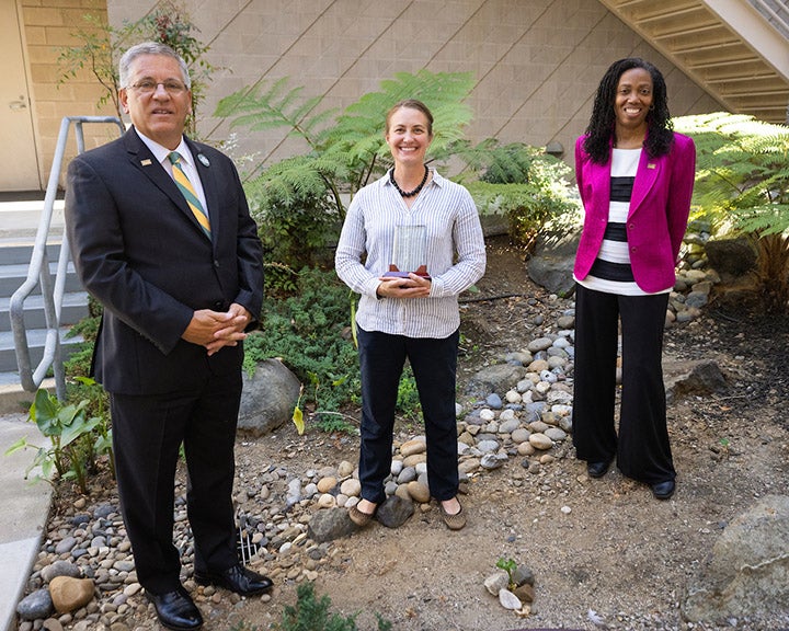  20-21 Distinguished Teaching Award winner Jenn Yost with President Armstrong and Provost Cynthia Jackson-Elmoore.