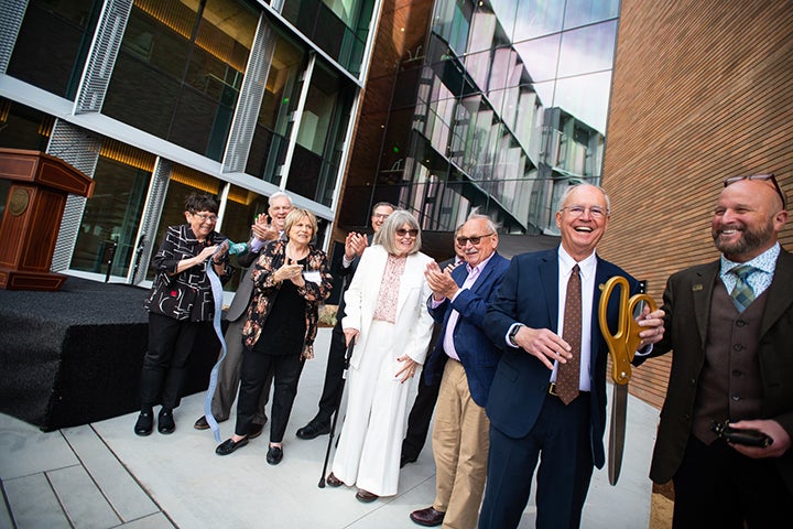 William Frost, Phil Bailey, Dean Wendt and other attendees smile after the dedication. Photo by Brittany App.