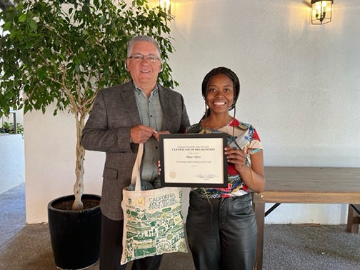 Maya Varlee and President Armstrong pose for a photo at the Outstanding Student Employees of the Year luncheon..