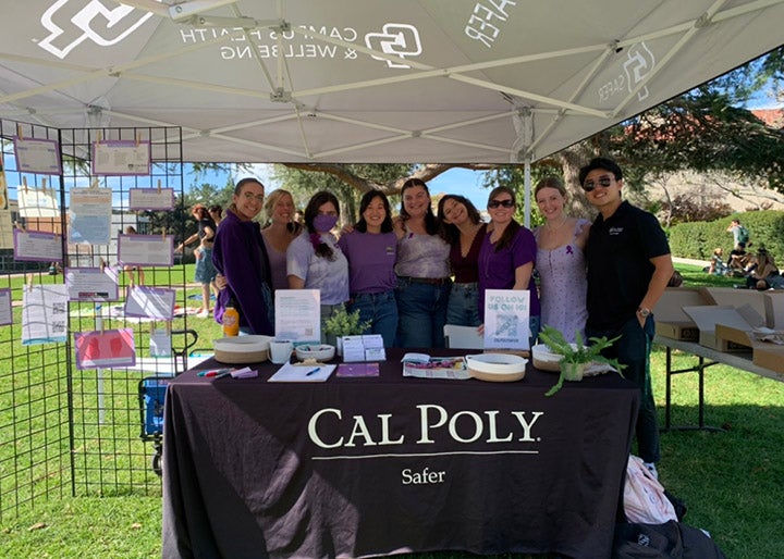 Students and staff share information at a Safer booth on Dexter Lawn.