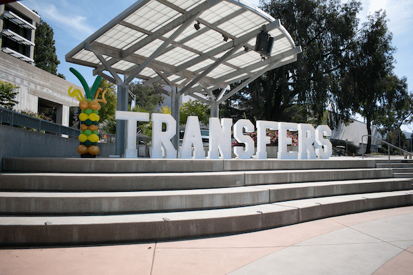 Transfer letters set on the stage in the University Union Plaza at Cal Poly