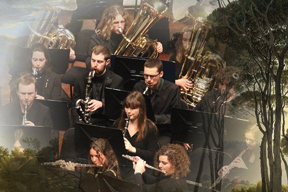 Members of the Cal Poly Wind Bands alongside a photo of pine trees.