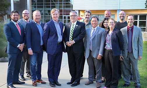 Executives from Cadence Design Systems Inc. visited Cal Poly's campus Nov. 9 to meet with university officials, who expressed their gratitude for the sizeable computational software donation. The group at Engineering Plaza included, from left, Daniel Marrujo; Zack Smith, Cal Poly’s vice president for development and alumni engagement; Michael Jackson; Charlie Schadewitz; Cal Poly President Jeffrey D. Armstrong; Dale Dolan; James Chew; Jojo Chang; Charles Chadwell; Amy Fleischer, dean of the College of Engineering; Chris Lupo; and David Junkin.