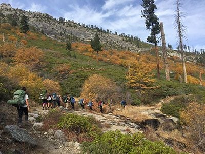 Backpackers hiking on a trail at Yosemite