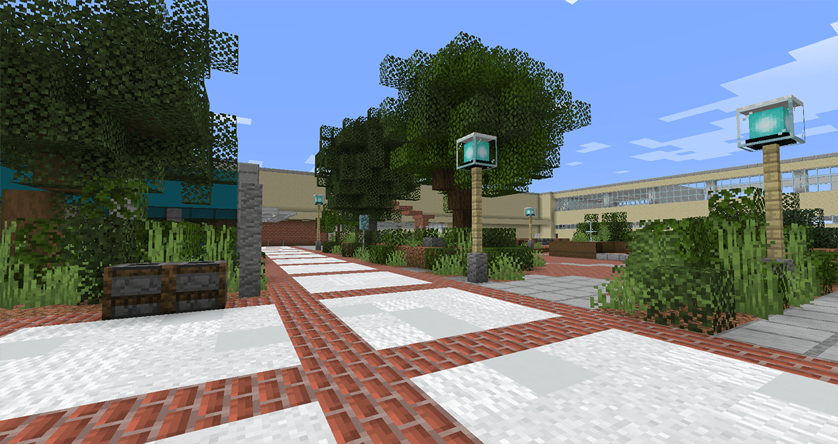 A view of a brick-lined and tree-filled courtyard built in Minecraft