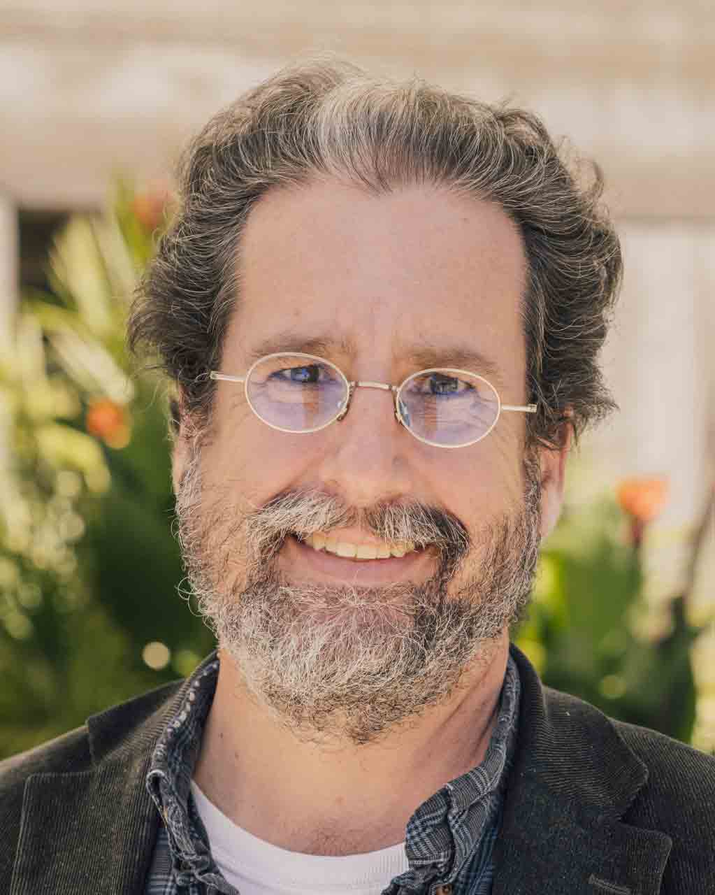 A headshot of physics professor Tom Gutierrez