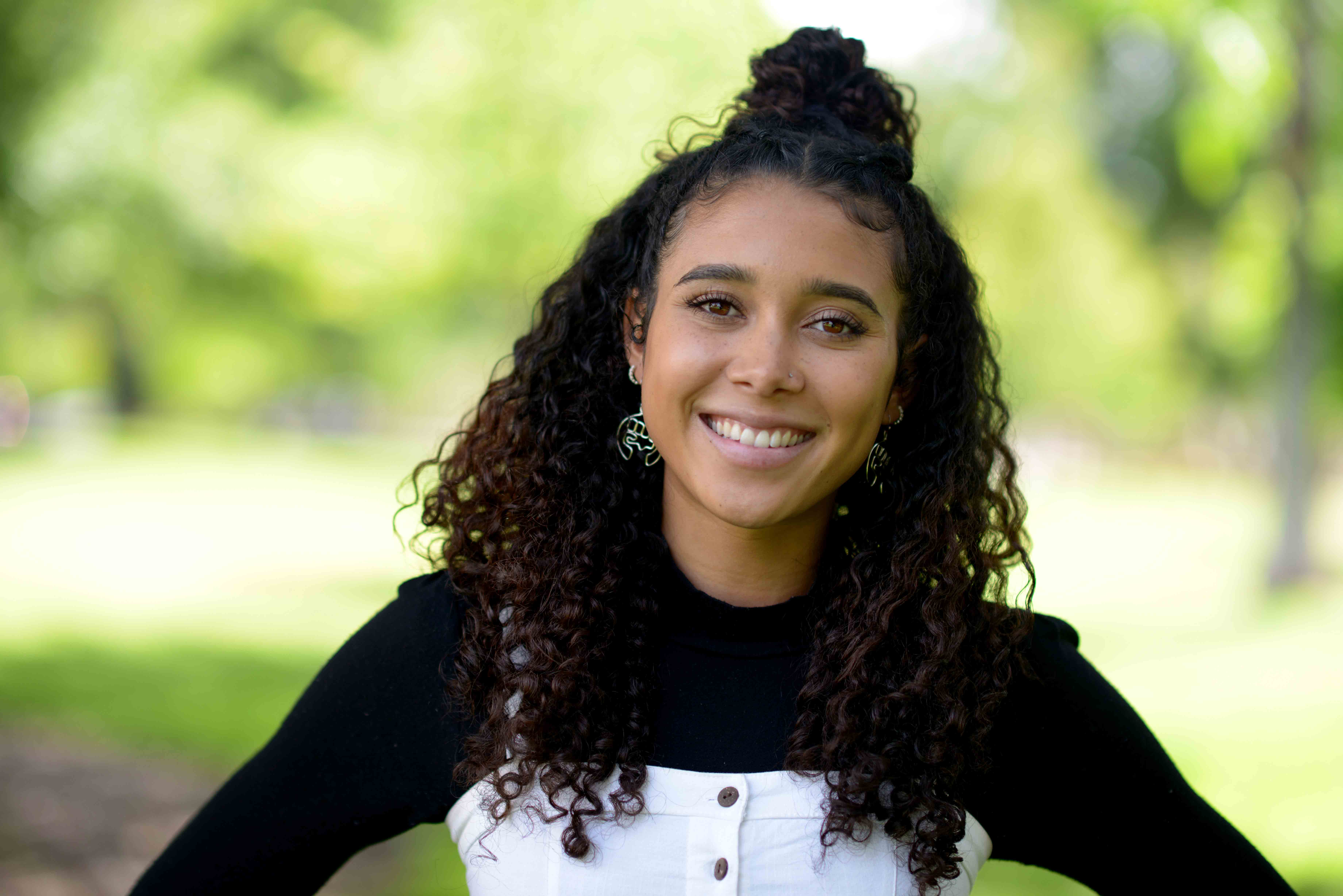 Chloe Wardrick wears a black shirt and smiles for her headshot.