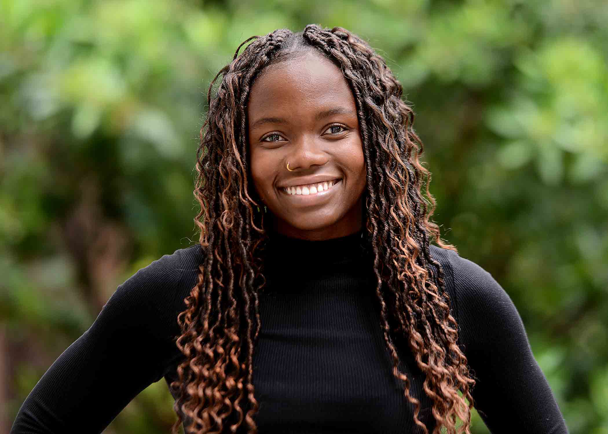 A professional headshot of soon-to-be-graduate Kimberley Bhunu, who is smiling at the camera.