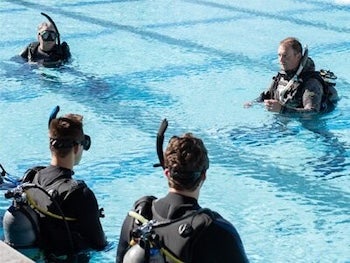 Scuba lessons take place in a pool. 