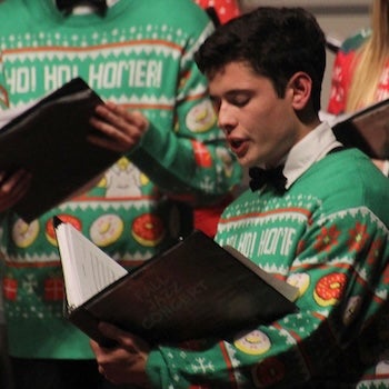 Choir singer with a festive sweater on. 