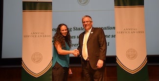 Genae Jenkins receives award from President Armstrong.