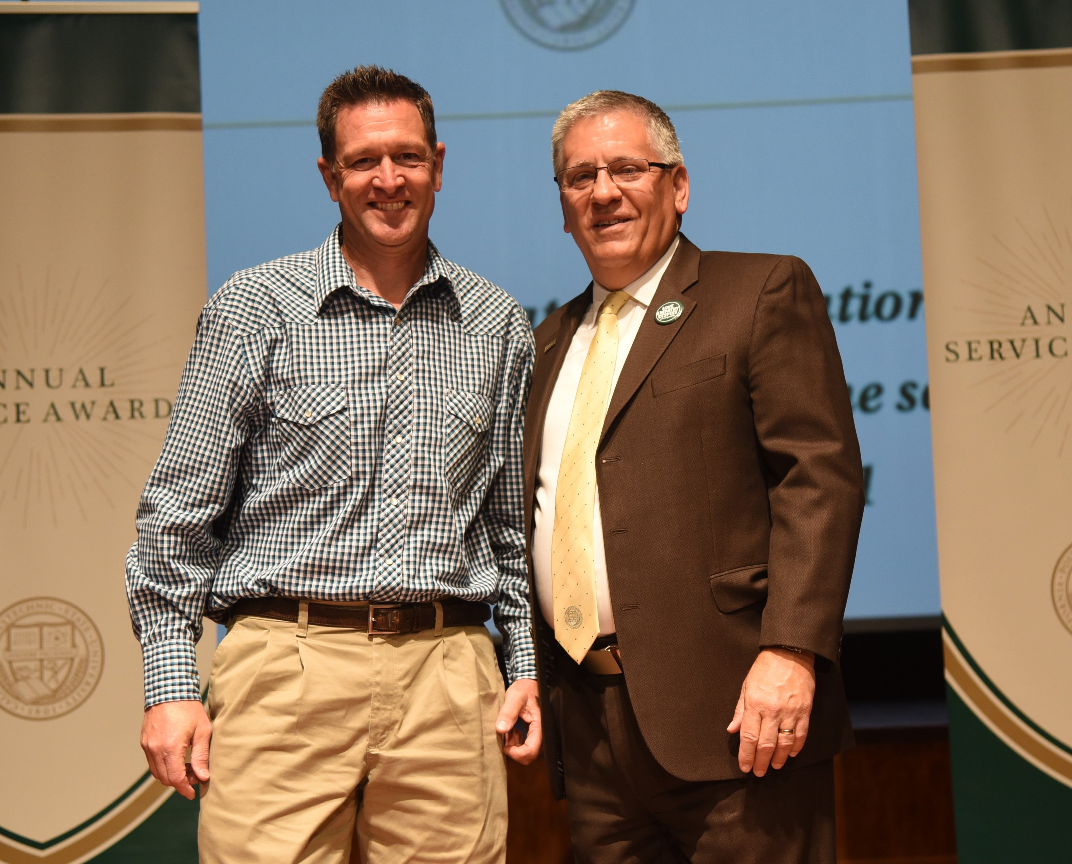 Josh D’Acquisto receives award from President Armstrong.