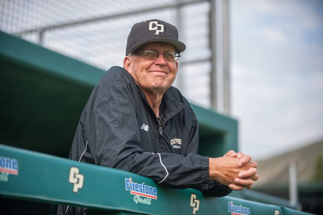 Eric Burdick standing at a Cal Poly sports venue