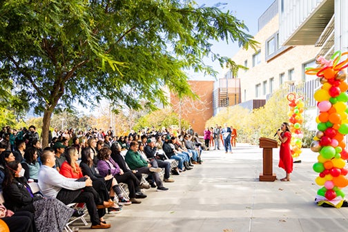 Daisy Paniagua-Uribe addresses a crowd of supporters at the La CASA grand opening.