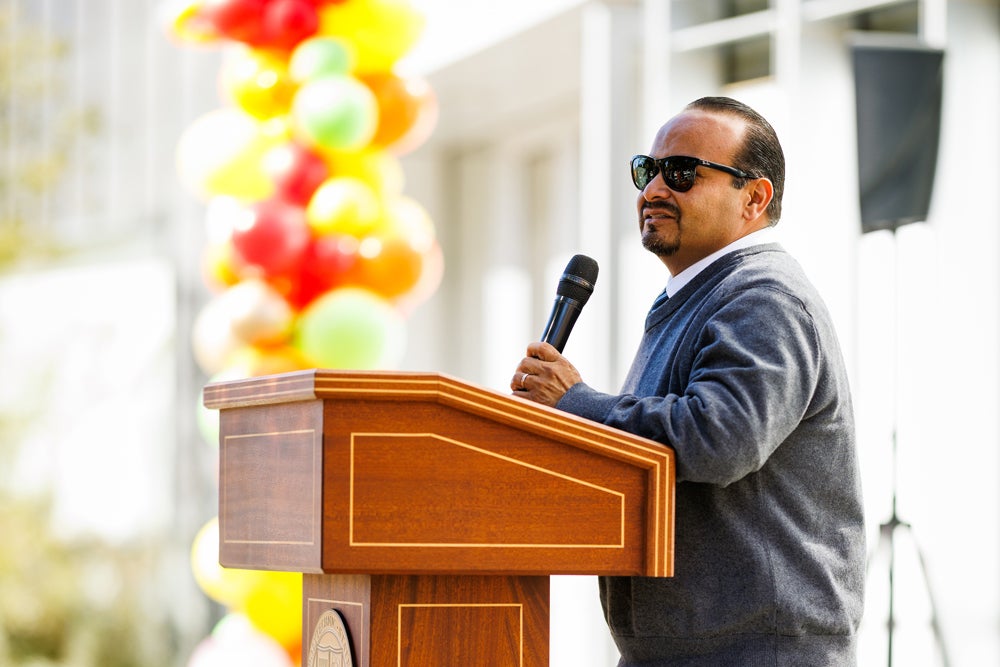 Professor José Navarro speaks to the crowd at La CASA's grand opening