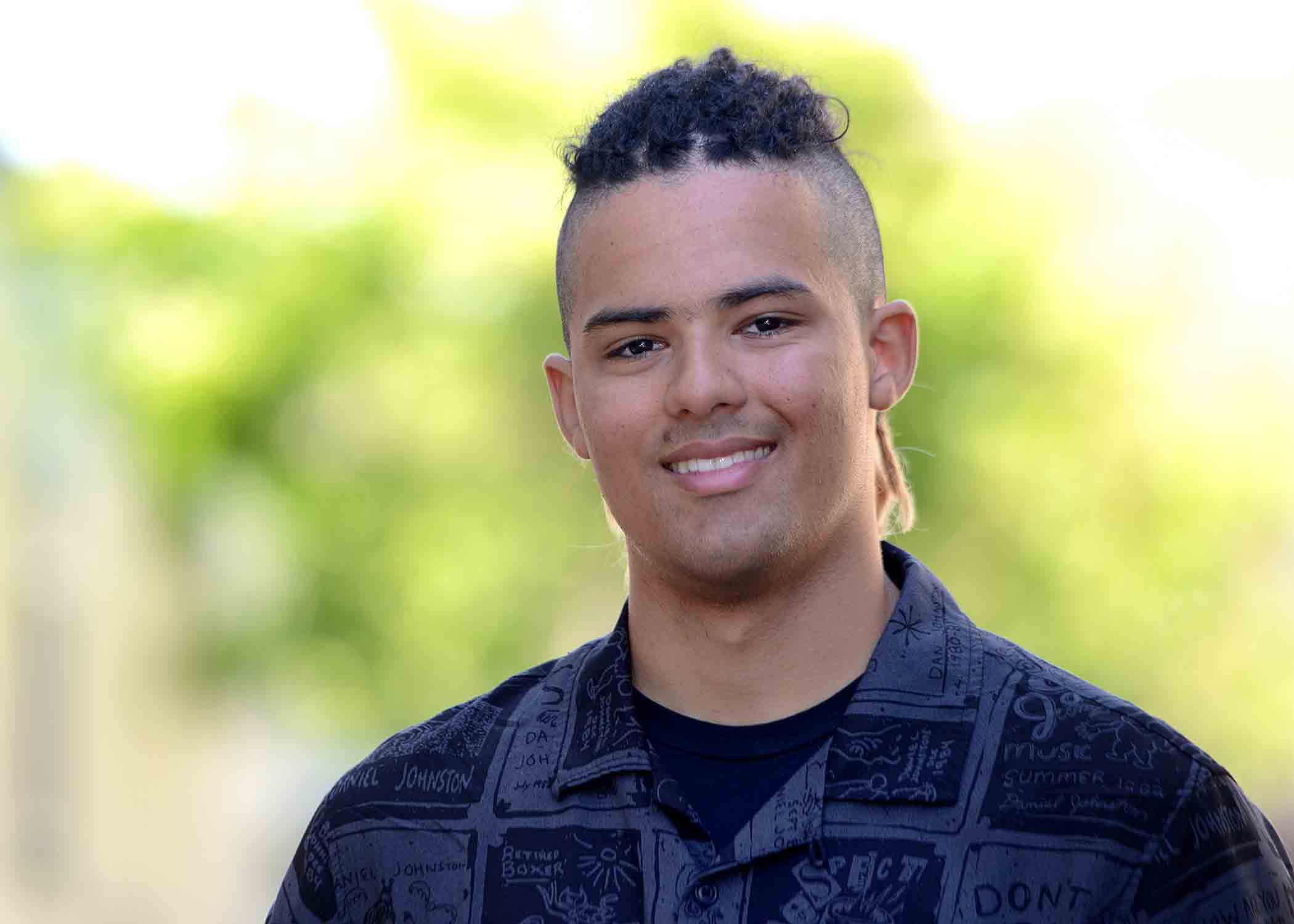 Soon-to-be graduate Jake Roth grins in a professional headshot.