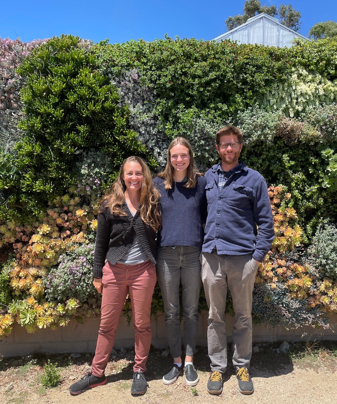 Biological sciences Professors Jenn Yost, left, and Matt Ritter join graduate student Cami Pawlak at Cal Poly’s Plant Conservatory. 