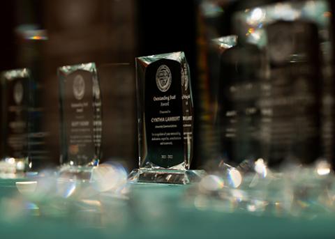 Table top showing a variety of faculty and staff awards